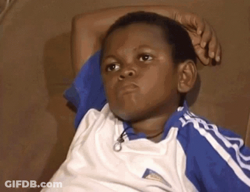 Young Boy Sitting On Couch Hand On Head GIF