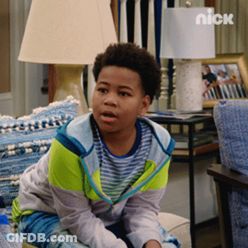 Young Boy Sitting On Couch With Nick Logo GIF