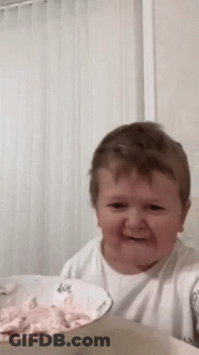 Young Boy Sitting With Bowl Of Food GIF