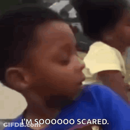 Young Boy Sitting With Eyes Closed Saying So Scared GIF