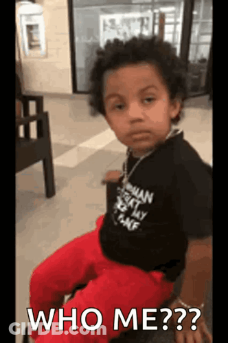 Young Boy Sitting With Who Me GIF