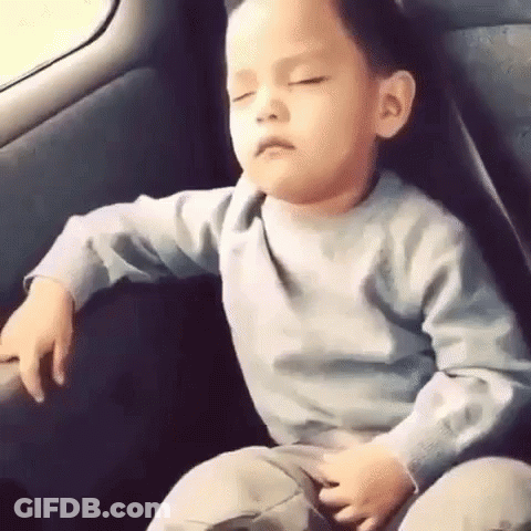 Young Boy Sleeping In Back Seat Of Car GIF