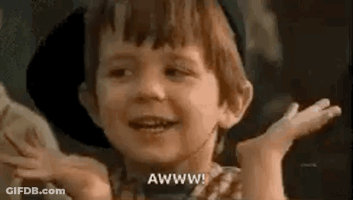Young Boy Smiling In Cowboy Hat Making Funny Face GIF