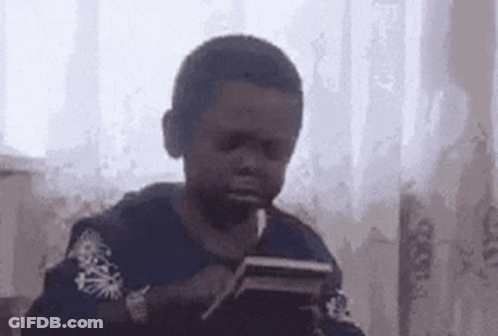 Young Boy Smoking Cigarette With Tablet GIF