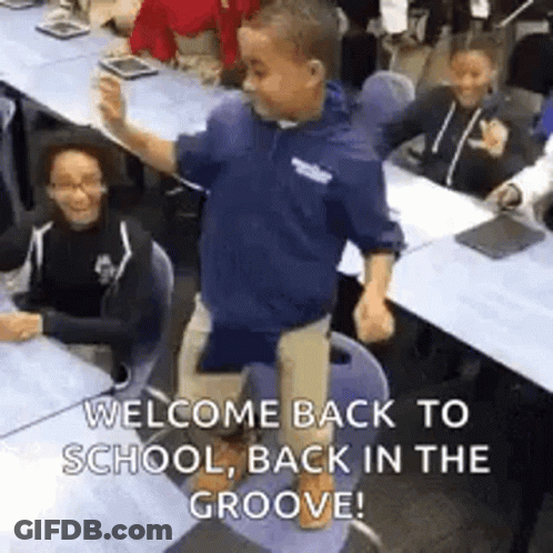 Young Boy Standing On Chair In Classroom GIF