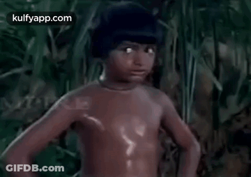 Young Boy Standing Shirtless In Woods GIF