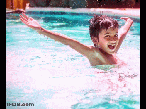 Young Boy Swimming Smiling GIF