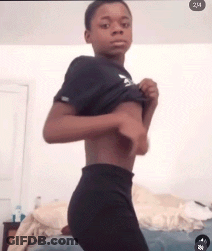 Young Boy Taking Off Clothes GIF