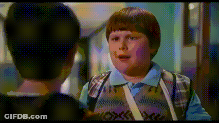 Young Boy Talking To Another Boy In Hallway GIF