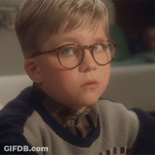 Young Boy Wearing Glasses And Sweater Saying A GIF