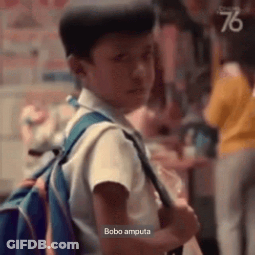 Young Boy With Backpack In Crowd GIF