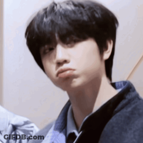 Young Boy With Black Hair Making Funny Face GIF