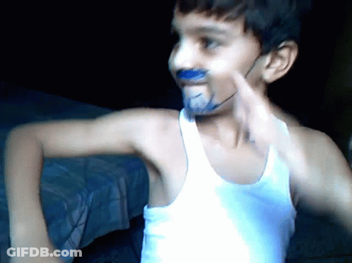 Young Boy With Blue Paint On Face And White Tank Top GIF