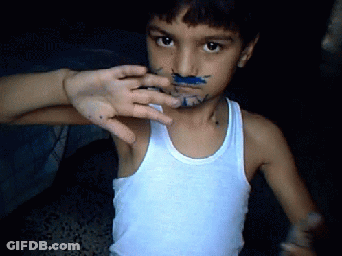 Young Boy With Blue Paint On Face In Tank Top GIF