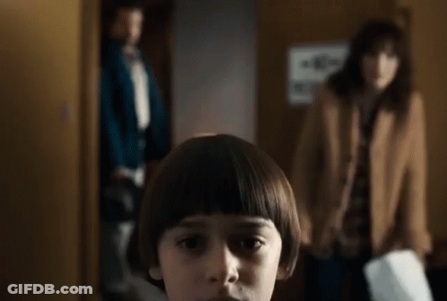 Young Boy With Bob Hairstyle In Front Of Woman And Man GIF