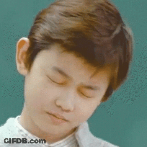 Young Boy With Eyes Closed Looking Down GIF