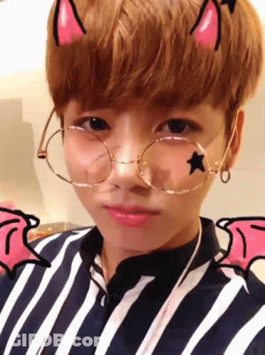 Young Boy With Forehead Star, Glasses, Striped Shirt GIF