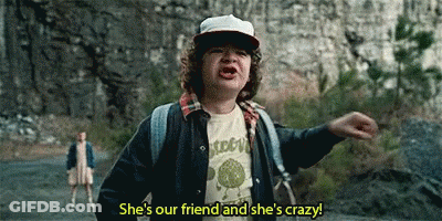 Young Boy With Hat And Backpack Talking To Woman On Road GIF