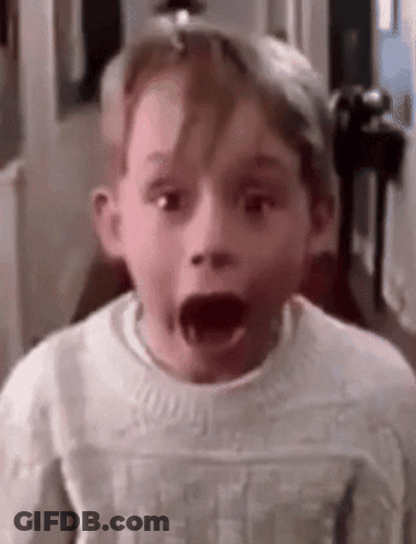 Young Boy With Mouth Open Wearing White Sweater GIF