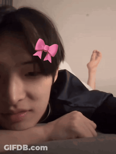 Young Boy With Pink Bow GIF