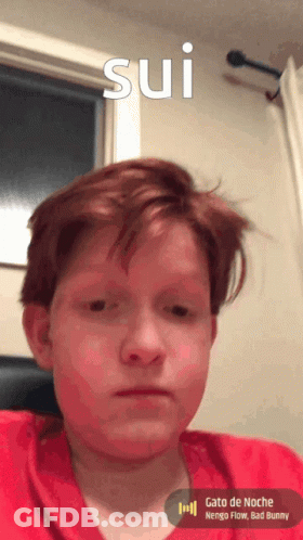 Young Boy With Red Hair Looking At Camera Sui GIF