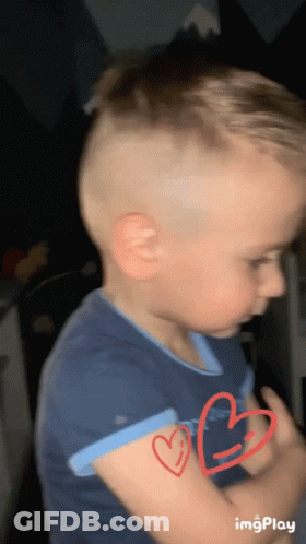 Young Boy With Two Red Hearts GIF