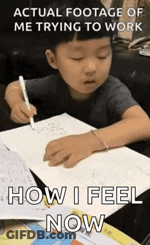 Young Boy Writing In Notebook At Table GIF
