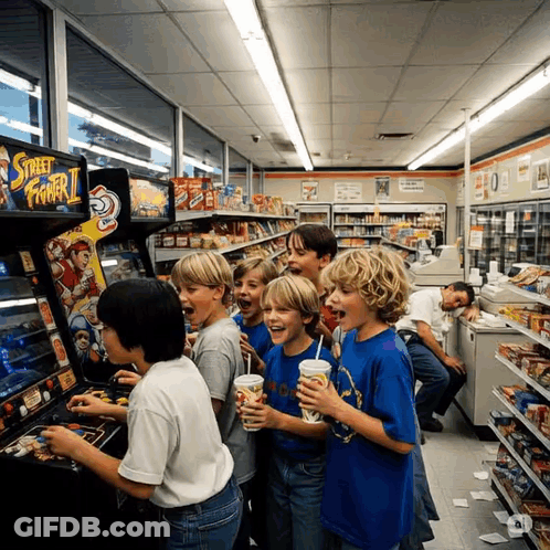 Young Boys Playing Street Fighter II In Store GIF