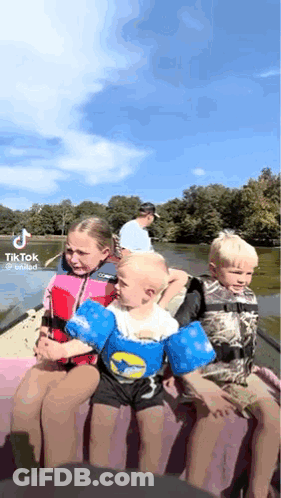 Young Children In Boat On Lake GIF