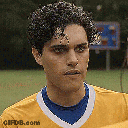 Young Curly Haired Man In Yellow Blue Soccer Jersey GIF