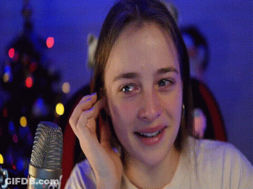 Young Girl Covering Ears At Microphone GIF