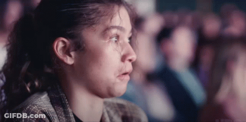 Young Girl Crying Watching Movie In Theater GIF