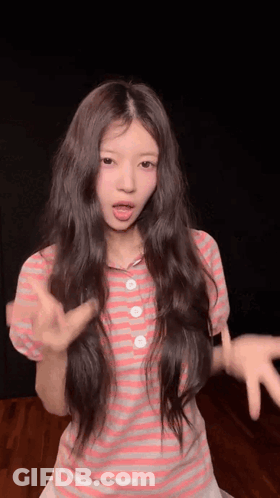 Young Girl In Pink And White Striped Shirt Making Funny Face GIF