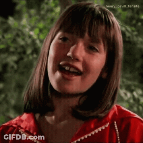 Young Girl In Red Jacket Making Funny Face GIF