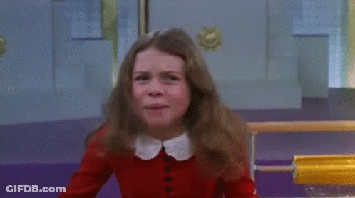 Young Girl In Red Sweater Crying In Front Of Yellow Object GIF