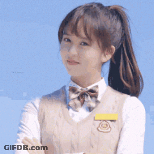 Young Girl In School Uniform With Arms Crossed And Ponytail GIF