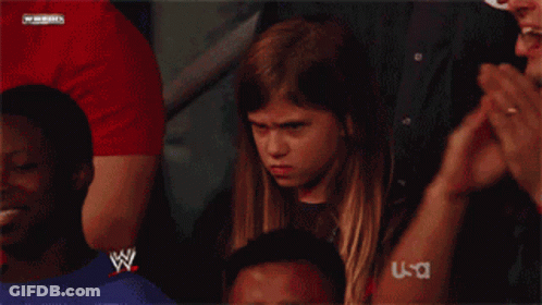 Young Girl In Wrestling Ring With W Logo Shirt GIF