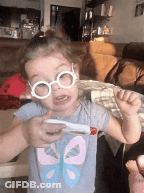 Young Girl Looking At Temperature In Thermometer GIF