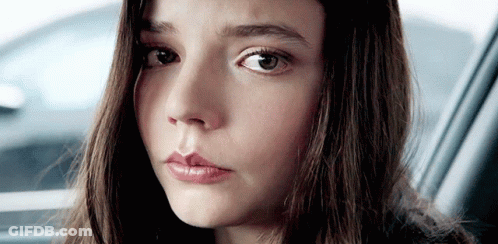 Young Girl Looking Out Car Window GIF