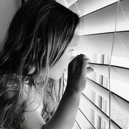 Young Girl Looking Out The Window GIF