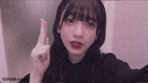Young Girl Making Funny Face And Pointing Finger GIF
