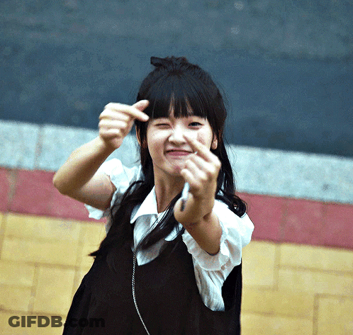 Young Girl Making Funny Face With Hands GIF