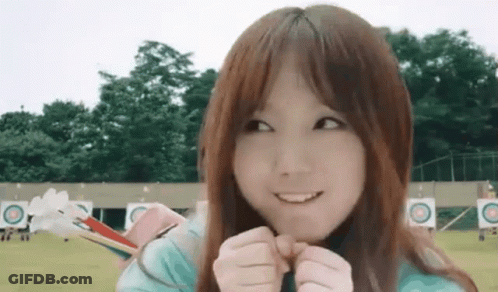 Young Girl Smiling Holding Bow And Arrow GIF