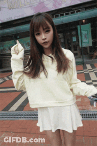 Young Girl Squatting With Legs Crossed Looking Up GIF