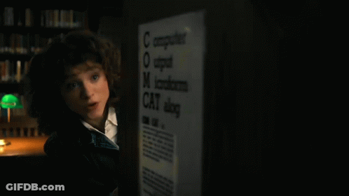 Young Girl Standing In Front Of Computer GIF