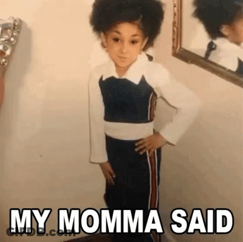 Young Girl Standing In Front Of Mirror GIF
