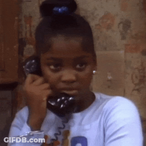 Young Girl Talking On Phone With Blue Ponytail GIF