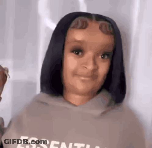 Young Girl Wearing Essentials Hoodie GIF