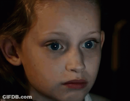 Young Girl With Blue Eyes Looking At Camera GIF