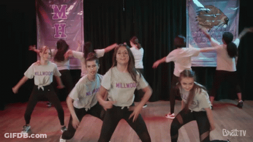 Young Girls Dancing In Front Of Millwood Banner GIF